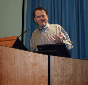 John Patrick at podium